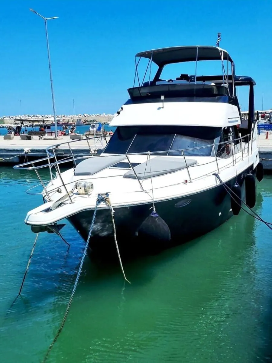 Sofia K moored bow-on in green harbour water