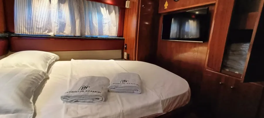 The stern cabin's double bed, made up with folded towels