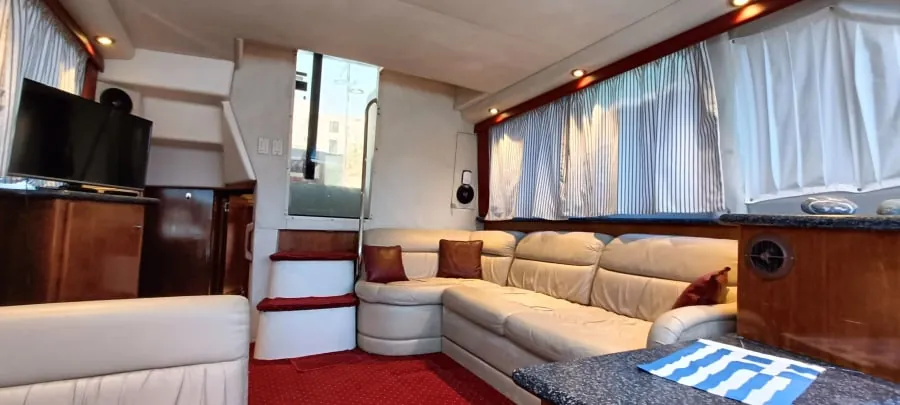 The salon, its sofas ready to convert into two single berths